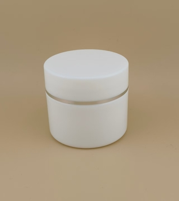 Pot à crème en plastique blanc avec bord argenté pour lotion féminine