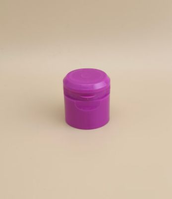 Un bon design en plastique violet rond, un bouchon lisse pour les bouteilles cosmétiques.