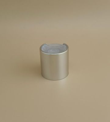 Couvercle lisse en aluminium-plastique argenté avec bouton clair pour les bouteilles de soins de la peau