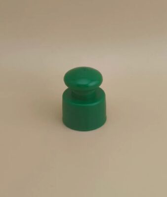 Bouchon lisse en plastique vert avec bouton pour flacons cosmétiques