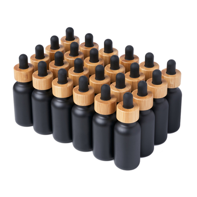 Le noir K1011 a enduit le pot rond de bouteilles en verre du chapeau en bambou de compte-gouttes