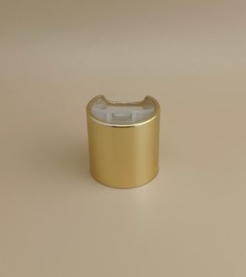 Bouchon rond en aluminium-plastique doré avec bouton transparent pour les bouteilles de soins de la peau