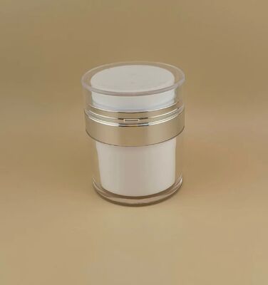 Bouteille argentée avec revêtement extérieur transparent pour produit de soins de la peau