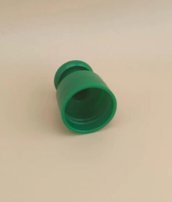 Bouchon lisse en plastique vert avec bouton pour flacons cosmétiques