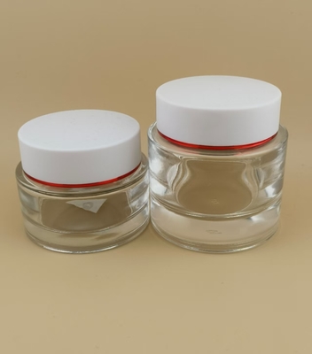 Bouteille de crème en verre transparent avec couvercle à vis blanche pour lotion féminine